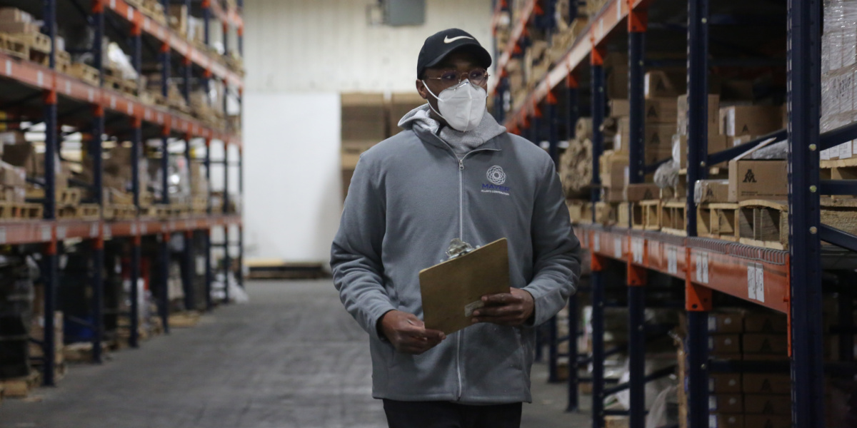 Mayer Alloys Warehouse Employee Surveying the Shelves